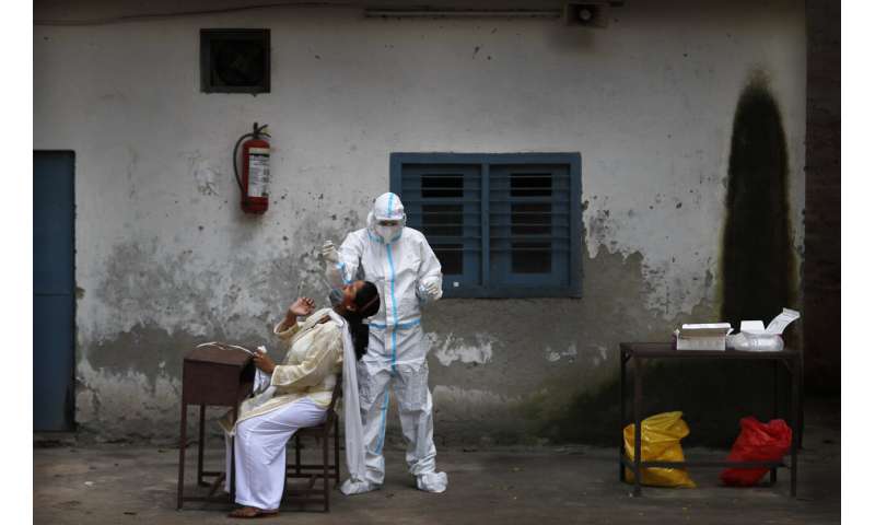 India eases virus restrictions as cases near 3.7 million