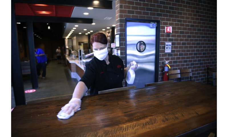 Masks, temperature checks mark 'new normal' at restaurants