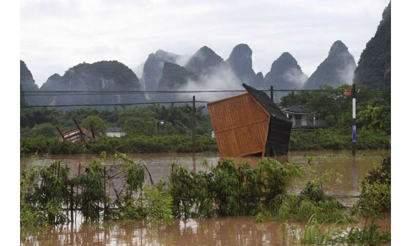 South China cleaning up from floods but more rain on the way