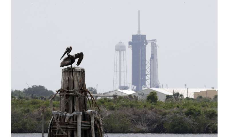 2 U.S. astronauts board SpaceX rocket for historic launch