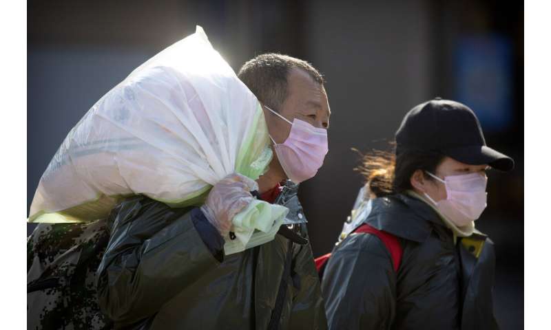 New virus cases fall; WHO says China bought the world time