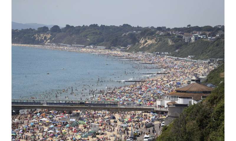 On hottest day of year, thousands cram onto English beaches