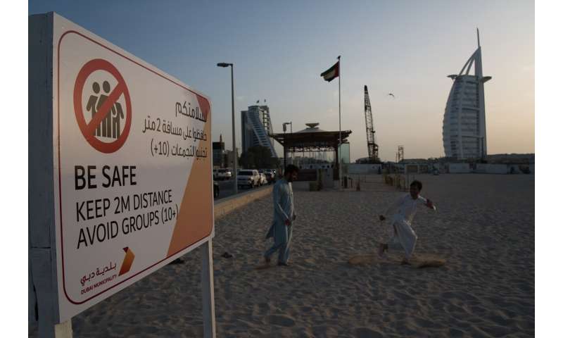 Travel hub UAE to halt flights as virus reaches Gaza, Syria