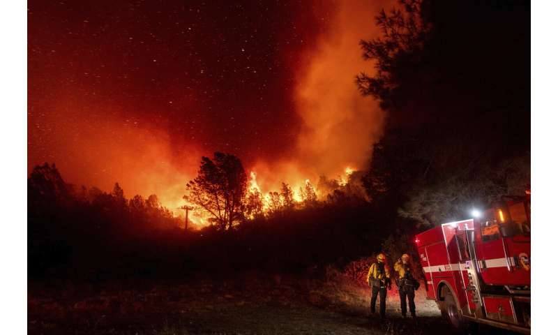 California wildfire explodes, burning across 25 miles in day