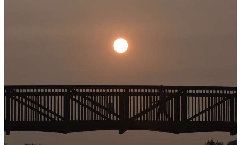 Wildfire smoke brings haze, vivid sunsets to East Coast