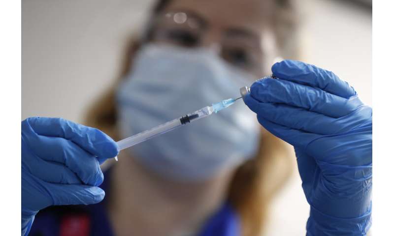 ‘Route out’ of pandemic: UK gives 1st COVID-19 vaccine doses