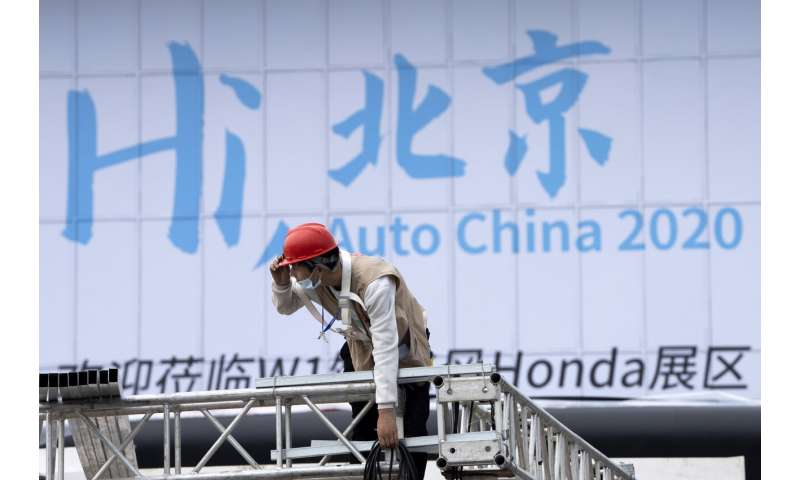 China auto show forging ahead under anti-virus controls