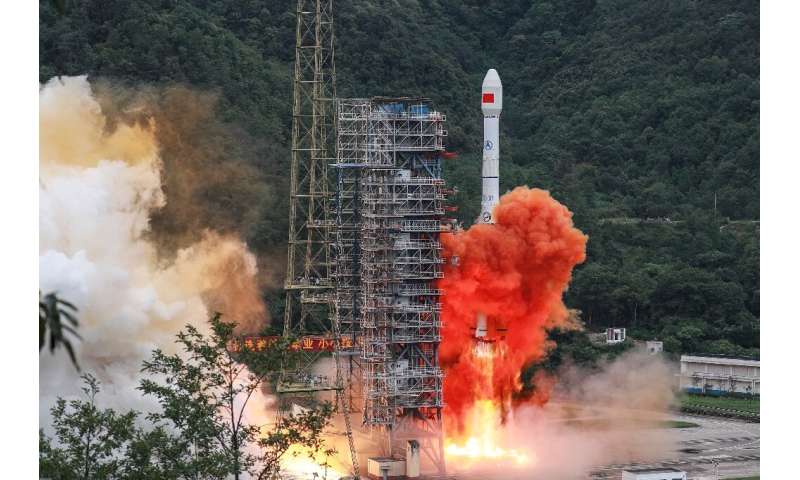 A Long March rocket lifts off from the Xichang Satellite Launch Center in Xichang in China's southwestern Sichuan province in Ju
