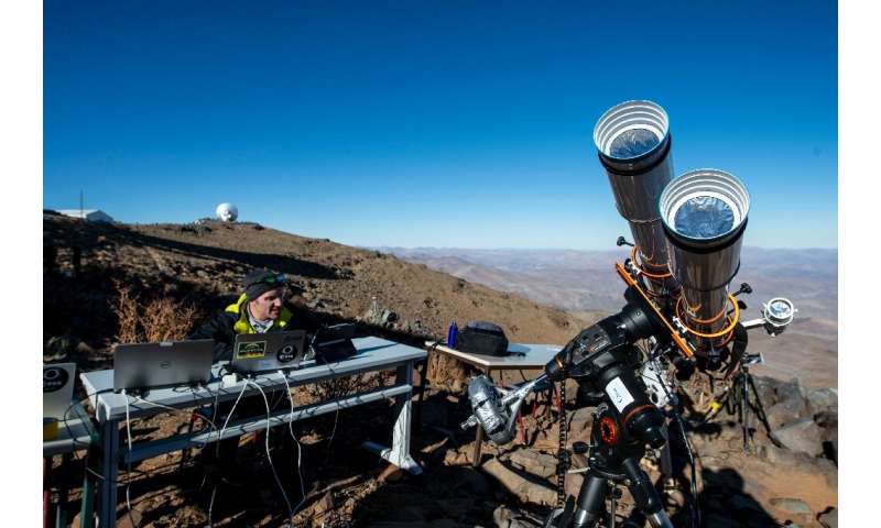 An astronomer prepares equipment ahead of a solar eclipse at the La Silla European Southern Observatory in Chile's Coquimbo regi