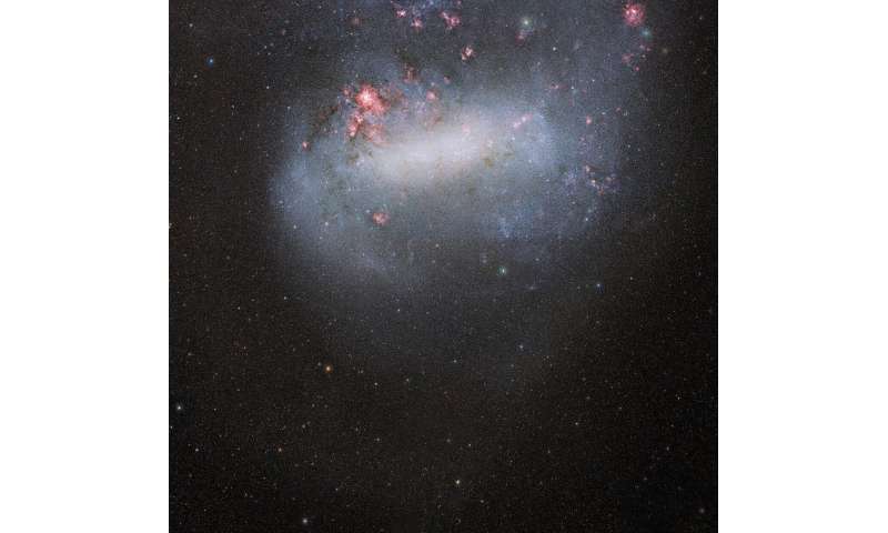 Dark energy camera snaps deepest photo yet of galactic siblings