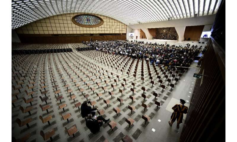 Limited worshippers attend an audience with Pope Francis at the Vatican.