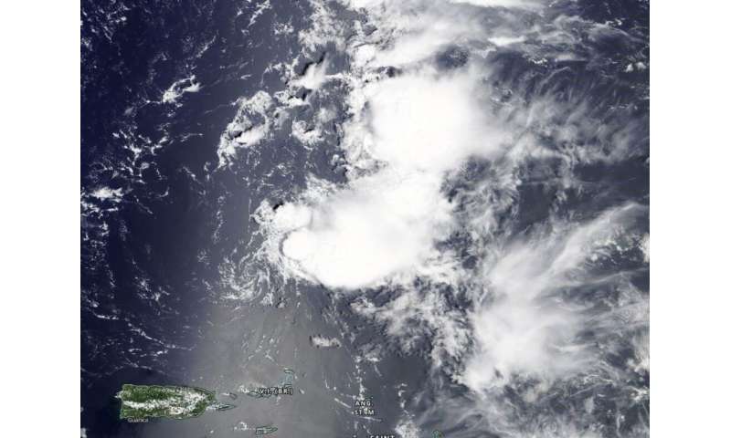 NASA sees former Tropical Storm Josephine open into a trough
