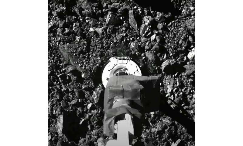 NASA spacecraft sent asteroid rubble flying in sample grab