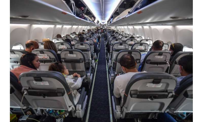 Passengers take their seats before take off in a Boeing 737 MAX aircraft operated by low-cost airline Gol at Guarulhos Internati