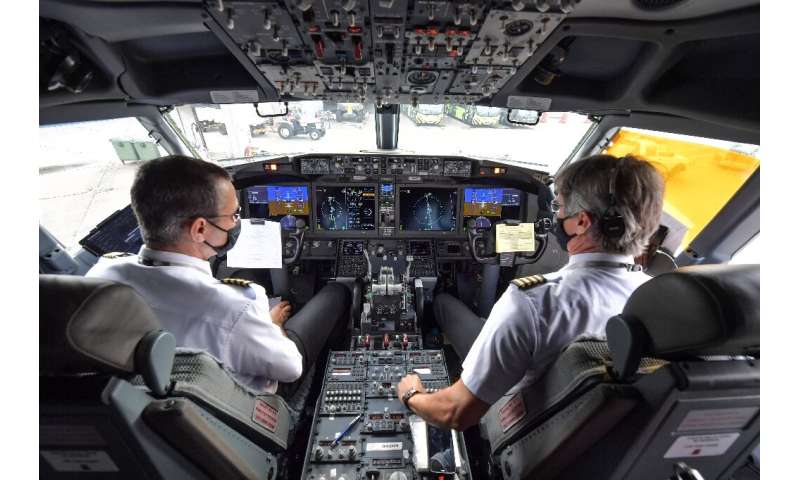 Pilots are pictured in the cockpit of a Boeing 737 MAX aircraft operated by low-cost airline Gol as it sits on the tarmac before
