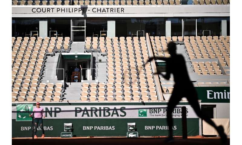 Players take part in a French Open warm-up session without spectators at Roland Garros