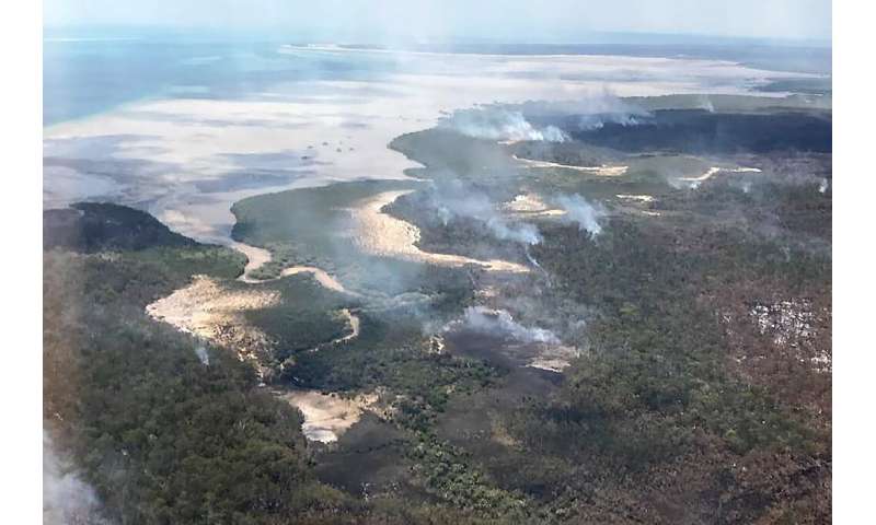 Queensland Parks and Wildlife Service said the fire was burning on two fronts