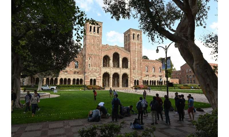 Students gather on the campus of University of California at Los Angeles (UCLA) in Los Angeles, among the schools suspending in-