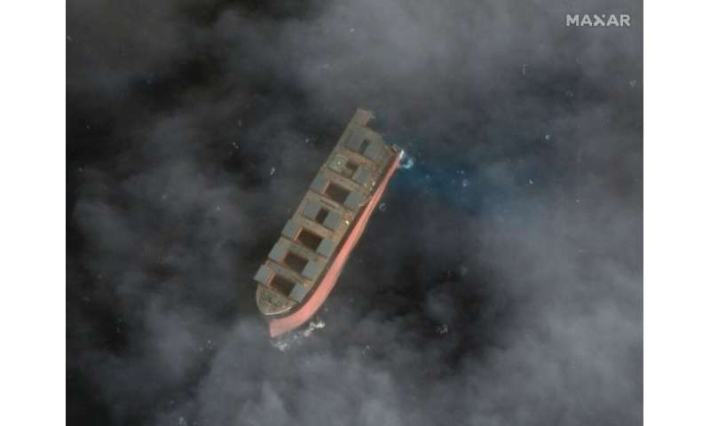 Two tugboats towed the larger part of the wreck some 15 kilometres (nine miles) out into the open ocean