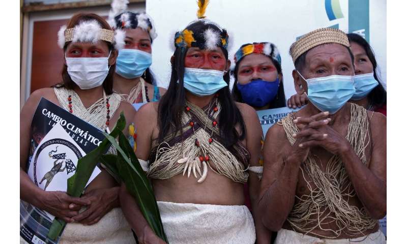 Waorani indigenous women pictured after filing a climate change lawsuit against Chinese oil company PetroOriental in El Coca, Or