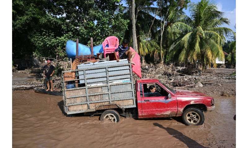 Workers evacuate from a banana plantation near El Progreso, Honduras, ahead of Hurricane Iota, in November 2020