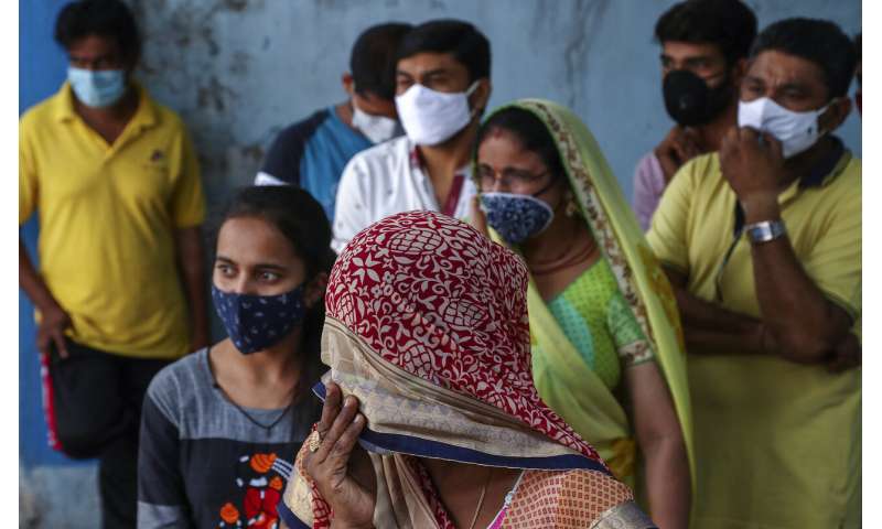 India's capital to lock down amid explosive virus surge