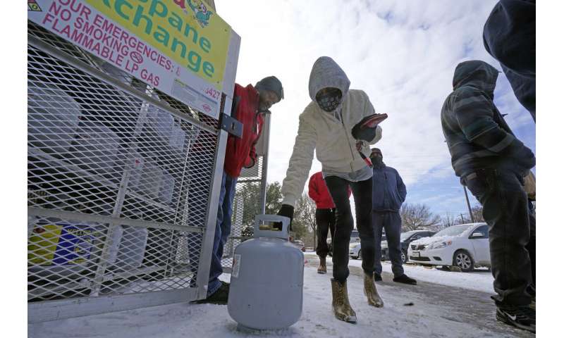 Millions endure record cold without power; at least 14 dead