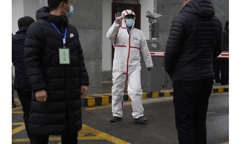 WHO team in Wuhan visits provincial disease control center