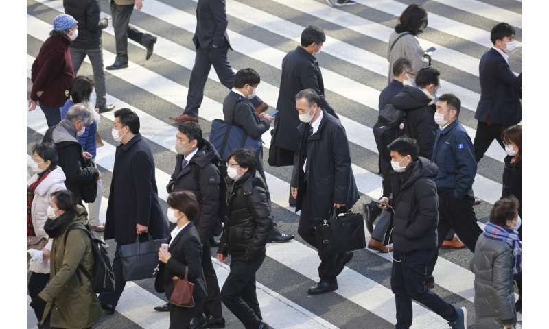 Japan widens virus emergency for 7 more areas as cases surge