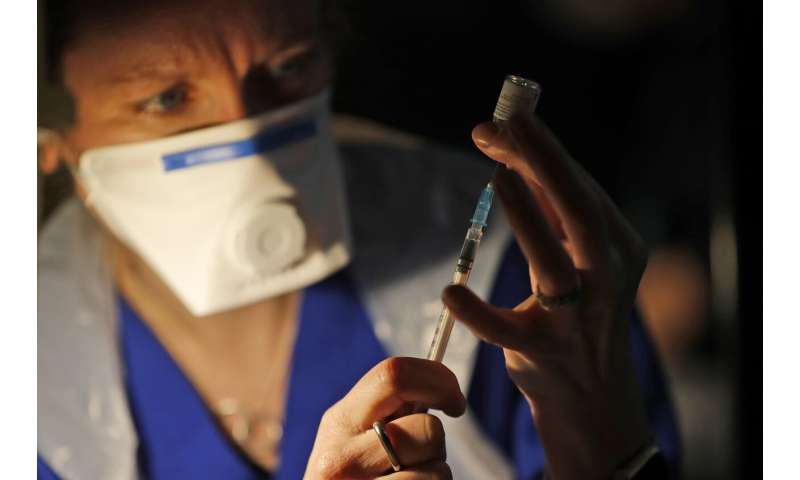 UK vaccination drive expands as virus toll nears 100,000
