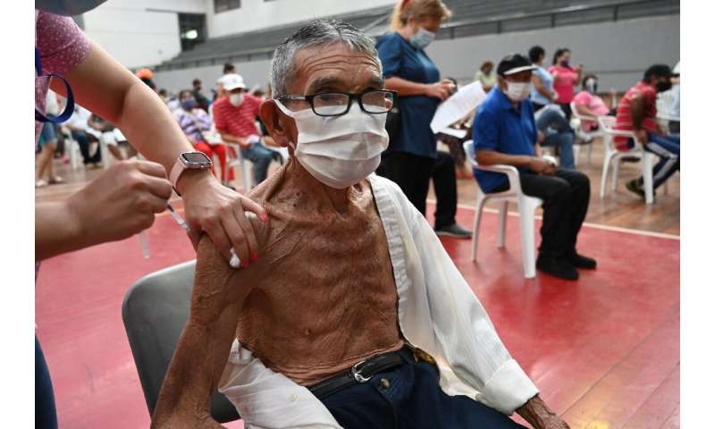 A man is inoculated with the Sputnik V vaccine against Covid-19 in San Lorenzo, Paraguay, on May 21, 2021