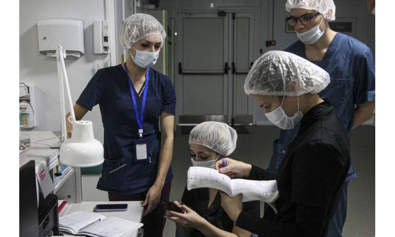 As virus cases rise, so do pleas for Russians to get vaccine