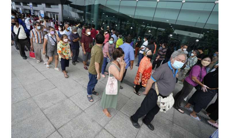 Bangkok closes public spaces as virus surges in Thailand