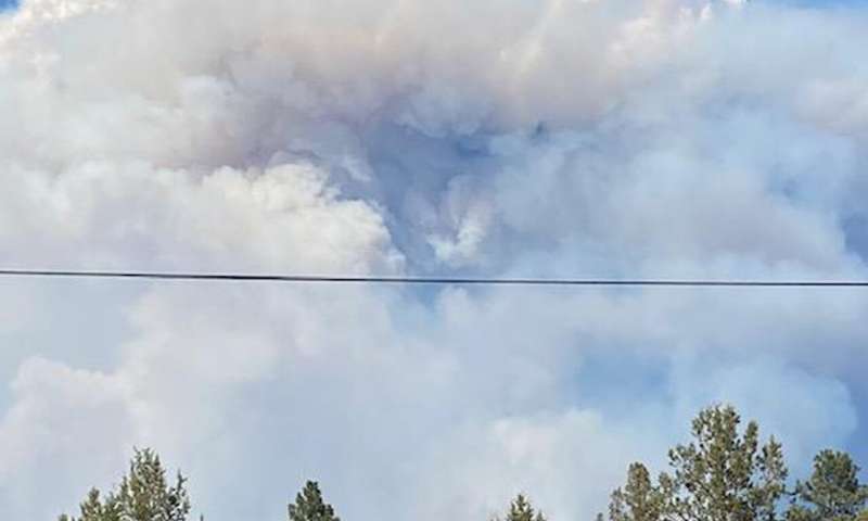 California fire prompts evacuations; Oregon blaze balloons