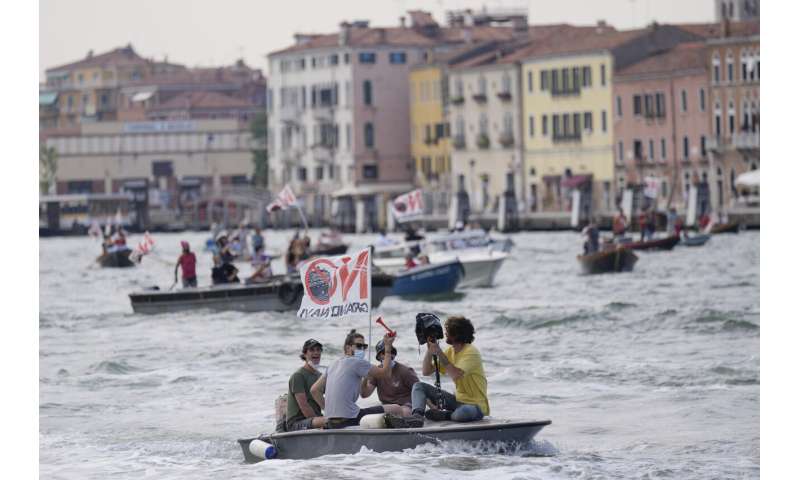 Cruise ships restart in Venice, bring environmental protests