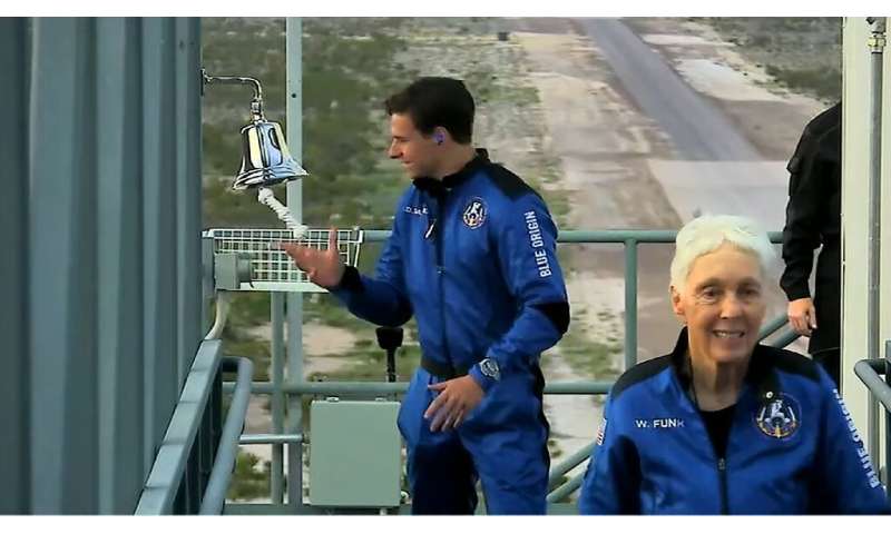 Dutch teen Oliver Daemen (L) and Wally Funk prepare to board the Blue Origin craft—they are now the youngest and oldest astronau