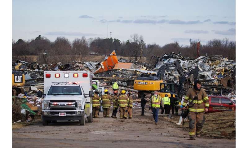 Emergency crews search through the debris of the flattened candle factory in Mayfield, Kentucky