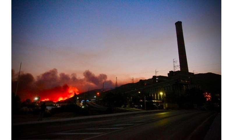 Flames soar close to a  power Plant near Oren, in Turkey's Mugla holiday region
