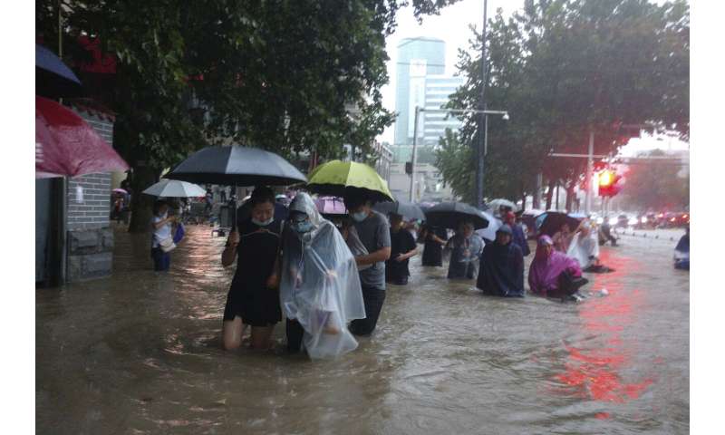 Flooding in central China turns streets to rivers, kills 12