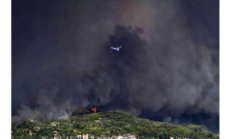 Forest fires rage in Greece, threaten Olympics birthplace