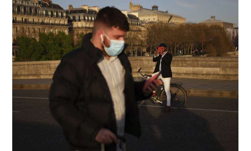 France eases mask rules; will end nightly virus curfew