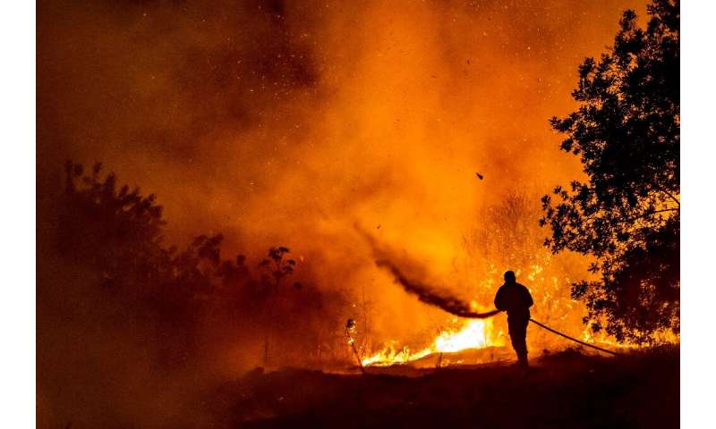 In this file photo from July 3, 2021 a giant fire rages in the Troodos mountains of Cyprus, the worst blaze on record on the Med