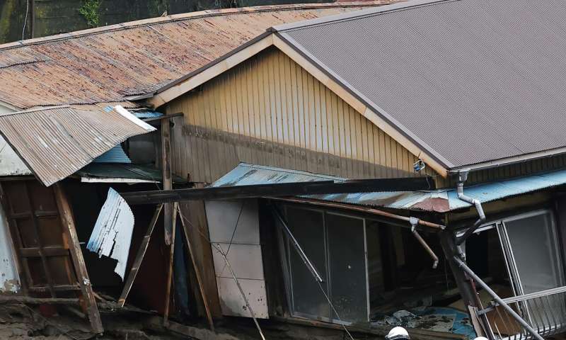 Japan searches for dozens missing in resort town mudslide