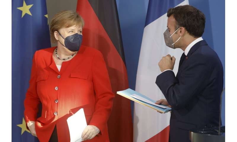 Leaders of Germany, France urge vigilance over virus variant