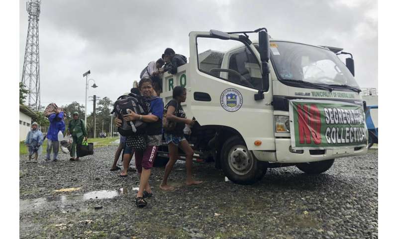 A powerful typhoon struck the Philippines, evacuating nearly 100,000 people