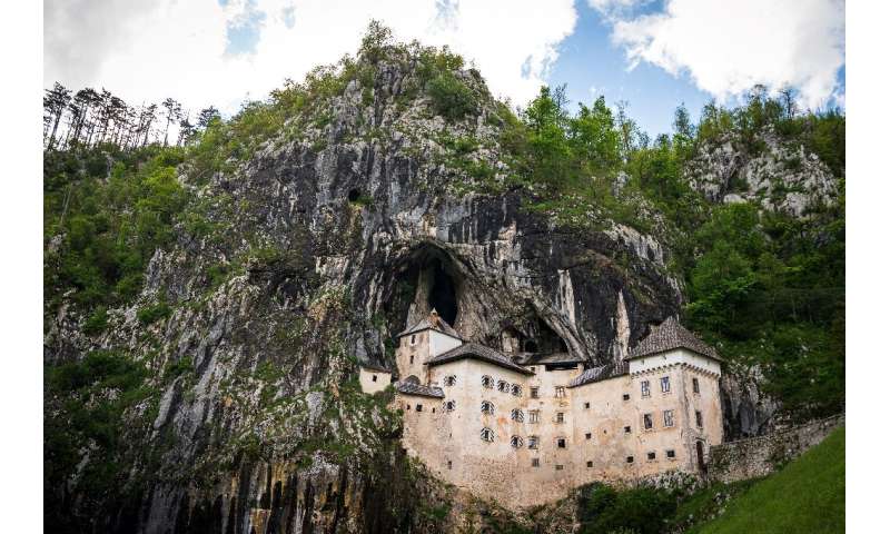 The medieval Predjama castle was built in a cave mouth to make access difficult and provide an escape route through a shaft in t