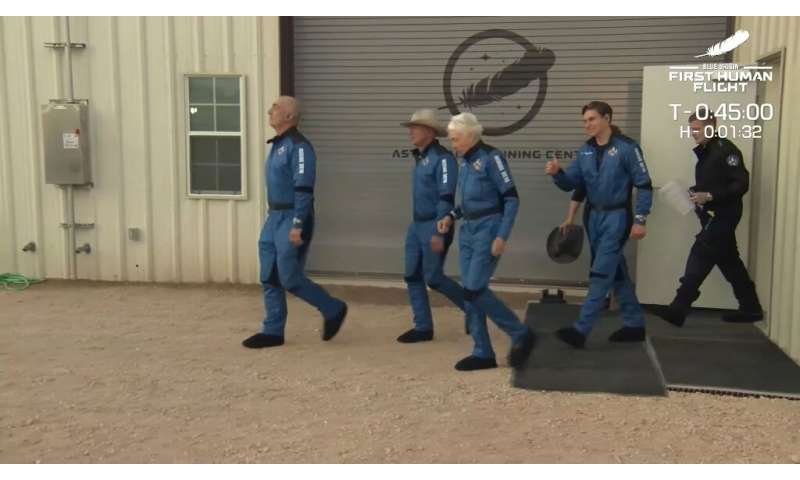 This still image taken from video by Blue Origin shows (L-R) Mark Bezos, Jeff Bezos,  Wally Funk and Oliver Daemen as they trave