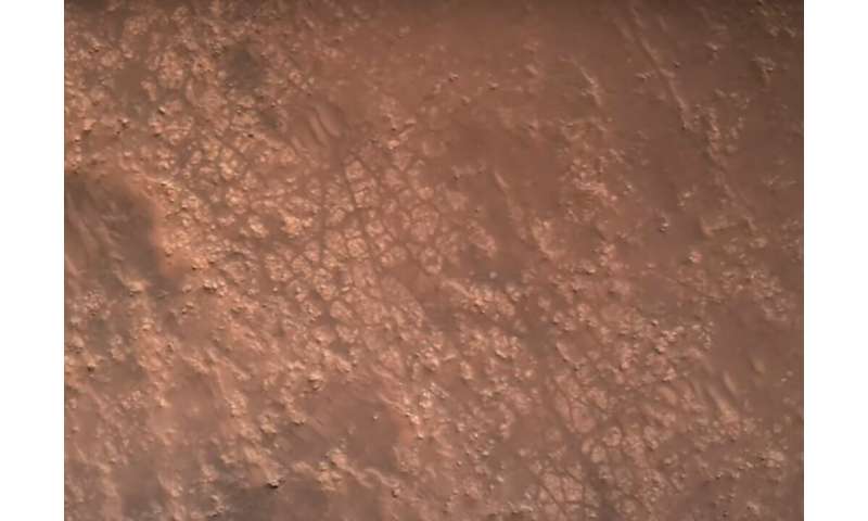 This NASA video frame grab photo released on February 22, 2021 shows the surface of Mars, captured by the Perseverance rover