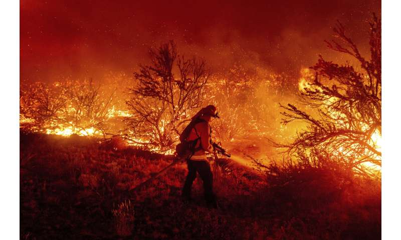 Winds drive nation's largest wildfire toward California city