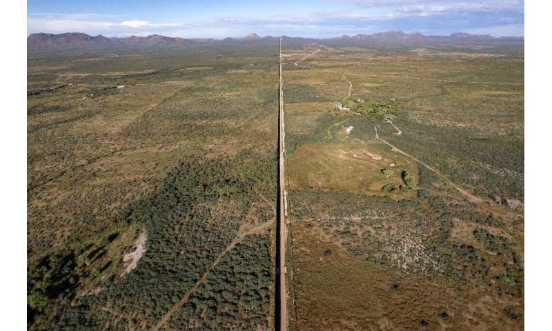An aerial view of part of the US-Mexico border wall between Arizona and Mexico's Sonora state
